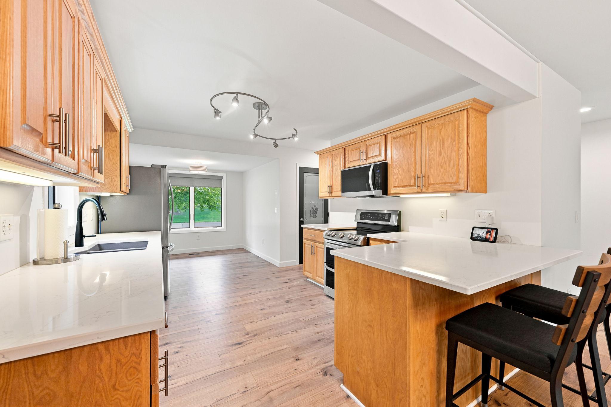 The kitchen features updated lighting and hardware!