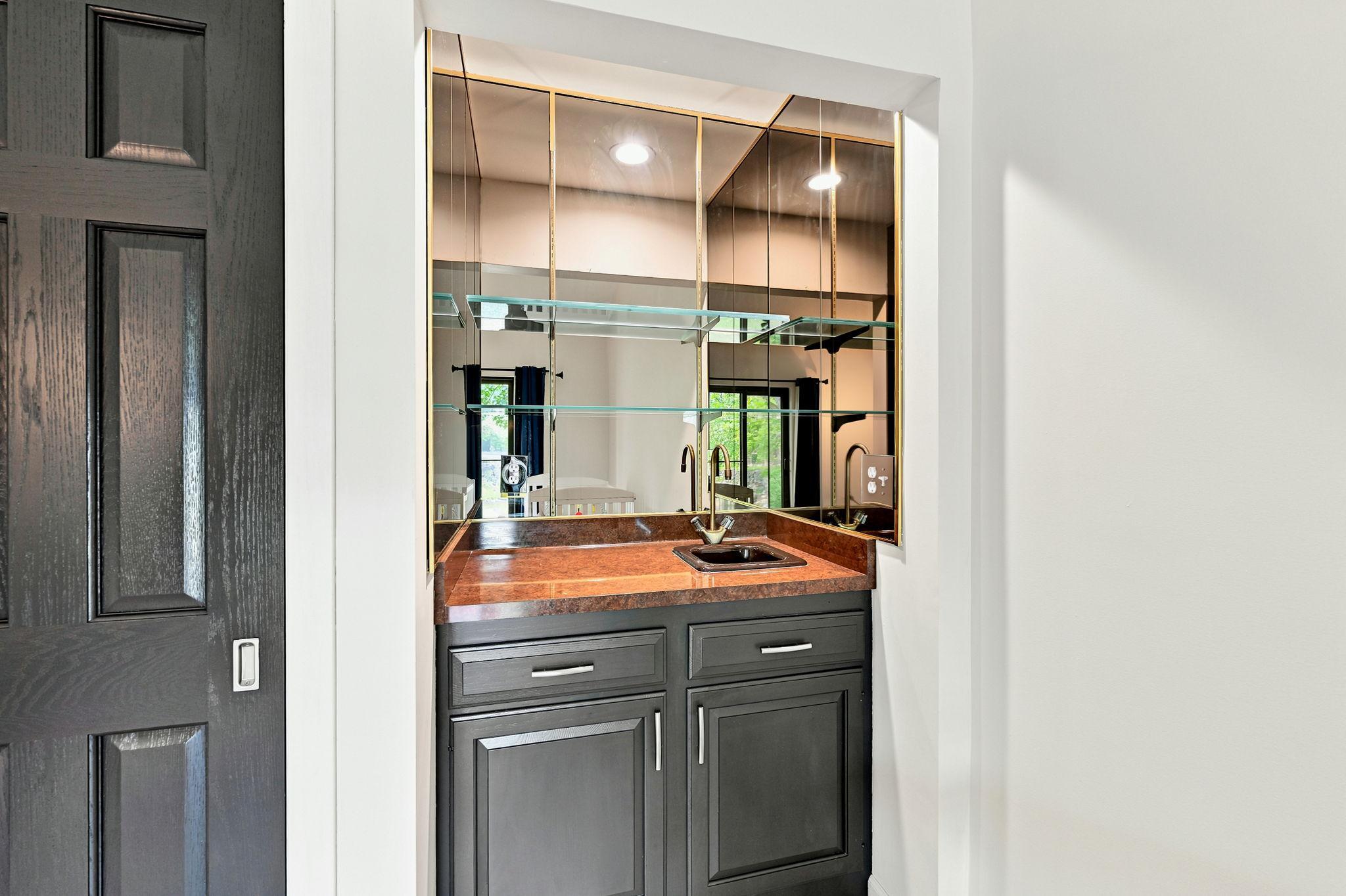 Convenient wet bar and walkout to the large patio add additional entertaining options!