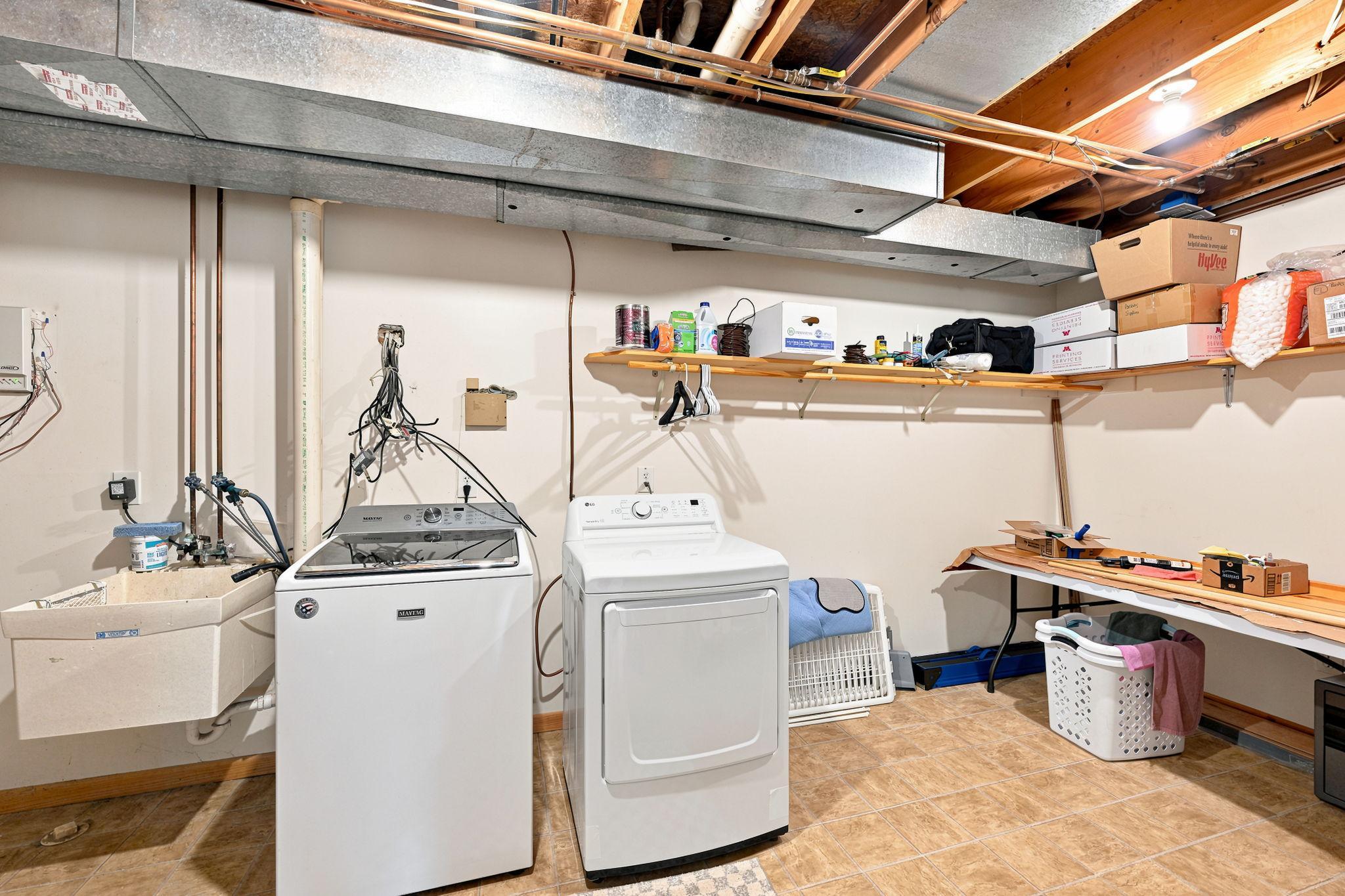 Laundry/utility room includes lots of extra storage!
