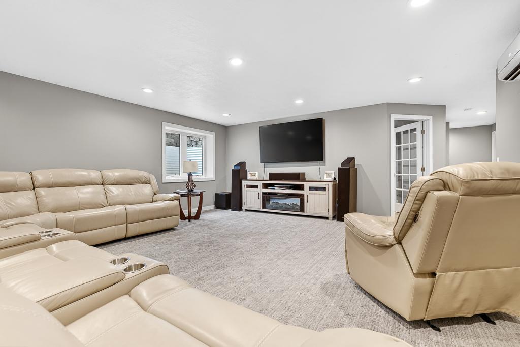 Spacious lower level family room! Such an awesome space to spread out and entertain or settle in and watch a movie