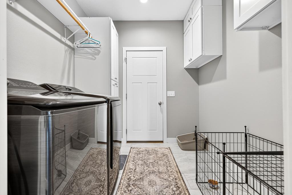Entry from attached garage features new washer and dryer - easy space to drop your dirty clothes off after a hard day working on the farm