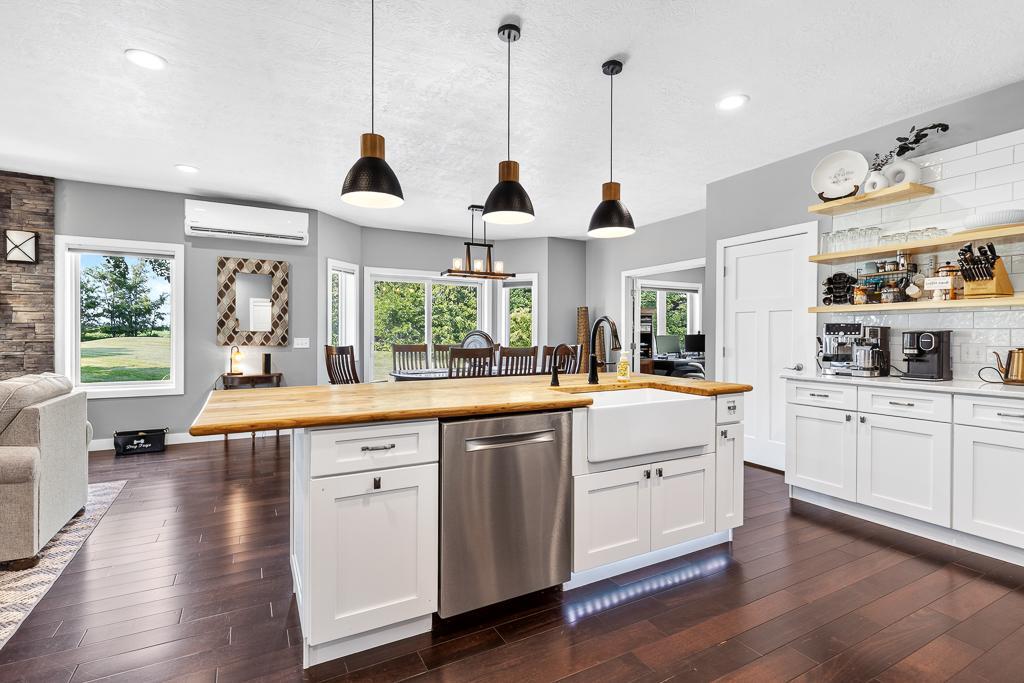 Many features for the center island! Farm house sink, convenient placement of the dish washer, and accent underlighting.