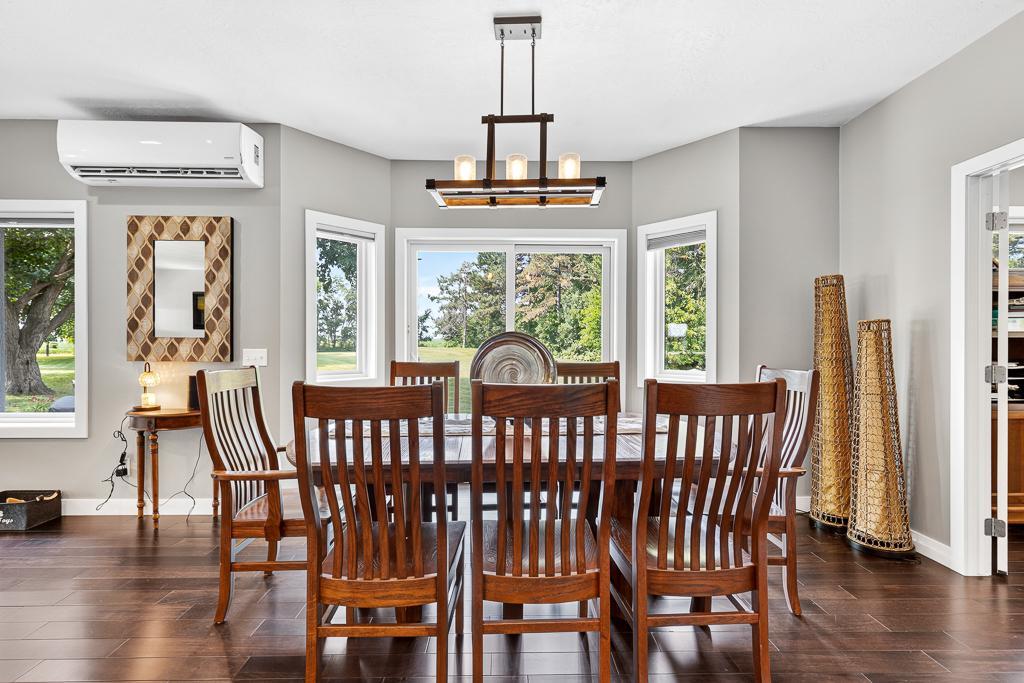 Dining table placement under a decorative hanging light fixture