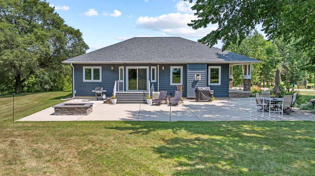 1200+ square feet of concrete patio with a raised fire pit for endless enjoyment of your peaceful surroundings