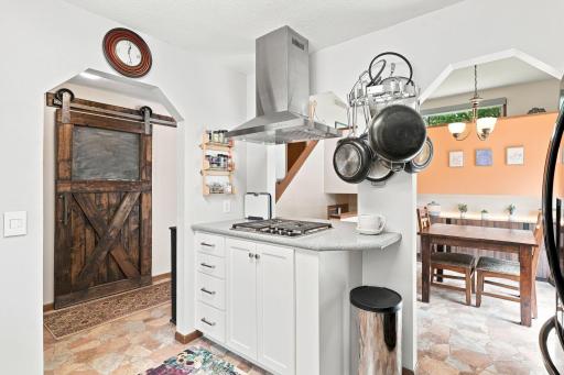 The island cooktop allows the cook to visit with everyone!