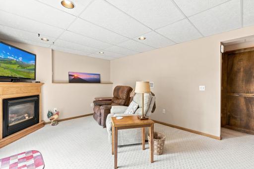Lower level family room with cozy gas fireplace and just freshly painted!