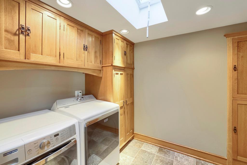 9815 Pioneer Trail - Main Floor Laundry with GREAT Storage and a skylight!
