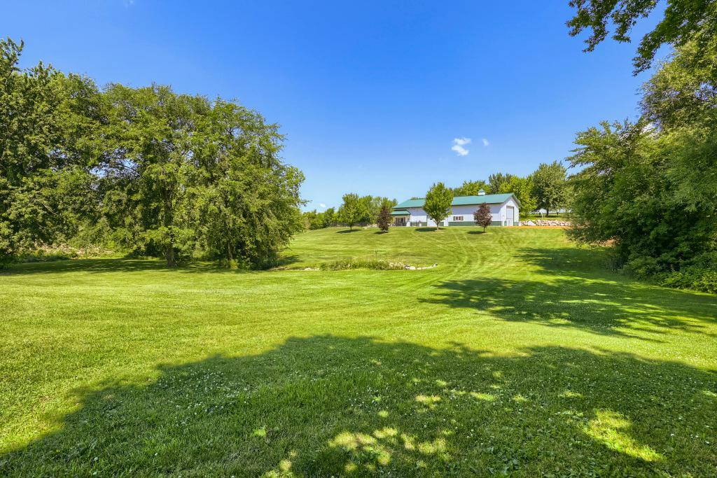 9815 Pioneer Trail - A Short walk/ride to your 80' x 42' Pole Shed, Rec Room and POOL!