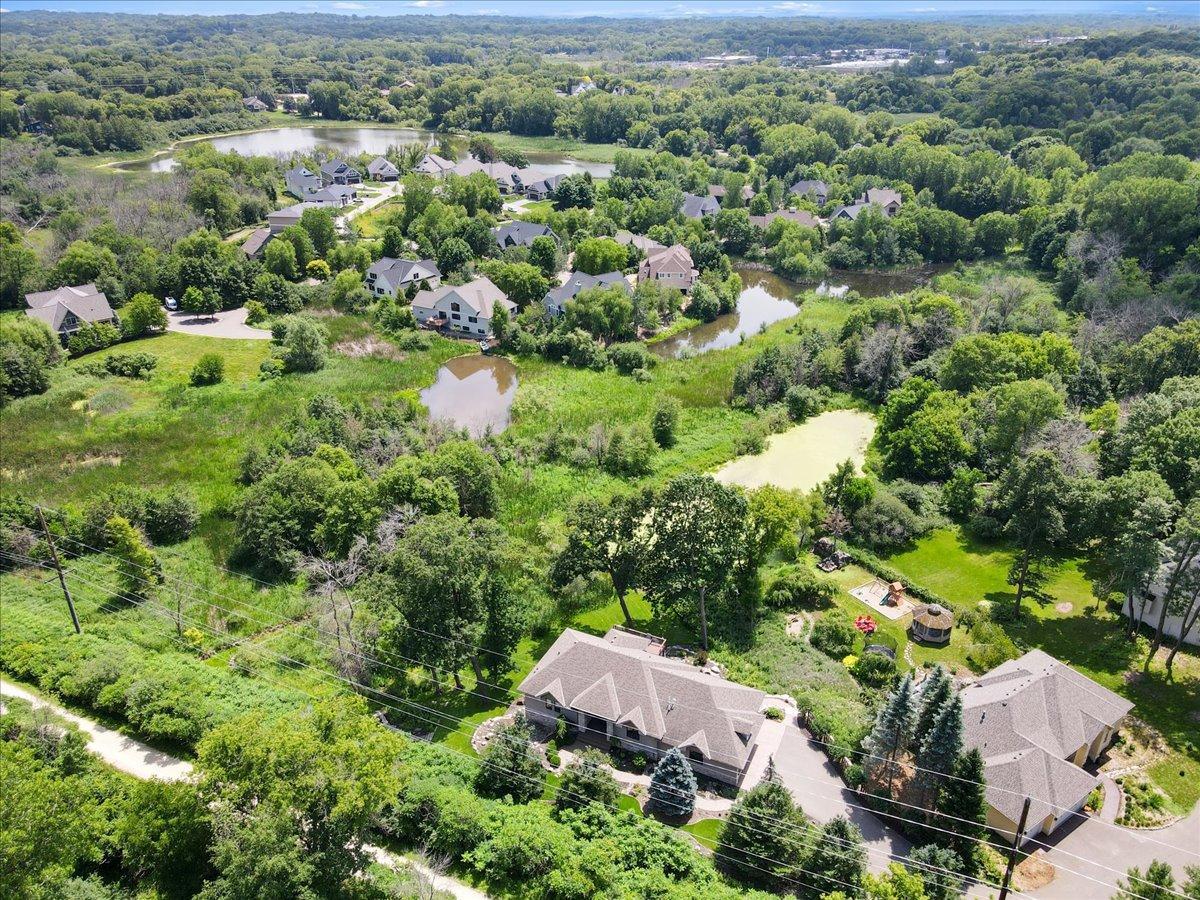 Although not visible from the home during the lush summer months, the LRT Regional Trail is conveniently located just beyond the front door, offering easy access to miles of scenic walking, biking, and recreational opportunities.