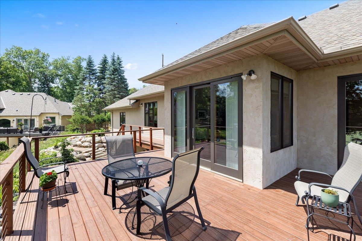 Designed for both beauty and function, the spacious deck features premium maintenance-free composite decking and contemporary open cable railing, allowing uninterrupted views of the scenic backyard and surrounding natural landscape.
