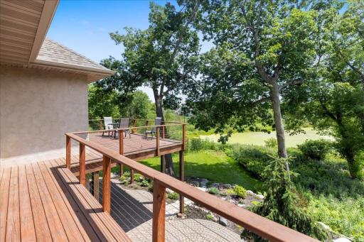 Take in the expansive views overlooking the surrounding woods and wetlands. The private backyard setting offers a peaceful natural backdrop, creating a rare sense of seclusion while still providing beautiful year-round scenery.