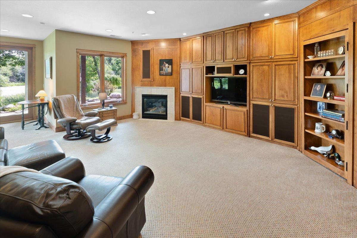 A true luxury amenity, the entire lower level is equipped with in-floor radiant heat, delivering consistent, efficient warmth and unmatched comfort. On chilly winter days, this premium feature transforms the space into a warm and inviting retreat.