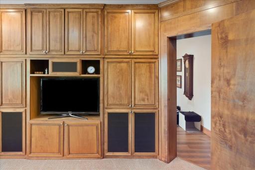 Behind the bookcase door lies another versatile and inviting space that can serve as an additional bedroom, flex room, or creative retreat for arts and crafts. This unique hidden room adds a unexpected element to the home's thoughtful design.
