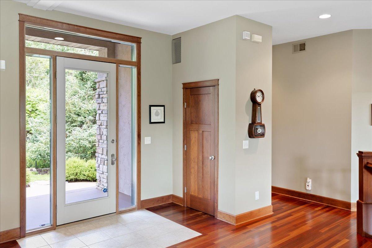 Throughout the main level, soaring 10-foot ceilings and oversized windows fill the home with natural light, enhancing its spacious, open-concept design while creating a bright and inviting atmosphere with a grand sense of scale.