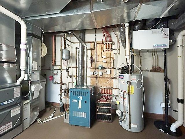 The mechanical systems are impressive, for comfort and efficiency throughout. A new high-efficiency forced-air HVAC system for year-round climate control, a separate boiler supplies in-floor radiant heat to the lower level, primary bathroom & garage.