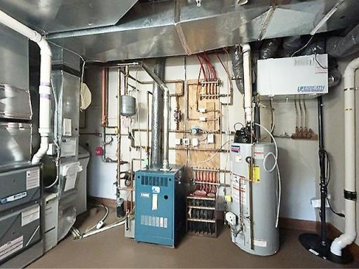 The mechanical systems are impressive, for comfort and efficiency throughout. A new high-efficiency forced-air HVAC system for year-round climate control, a separate boiler supplies in-floor radiant heat to the lower level, primary bathroom & garage.