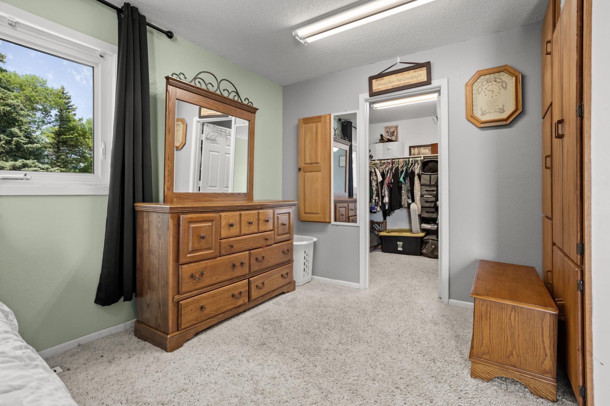 Primary bedroom walk-in closet