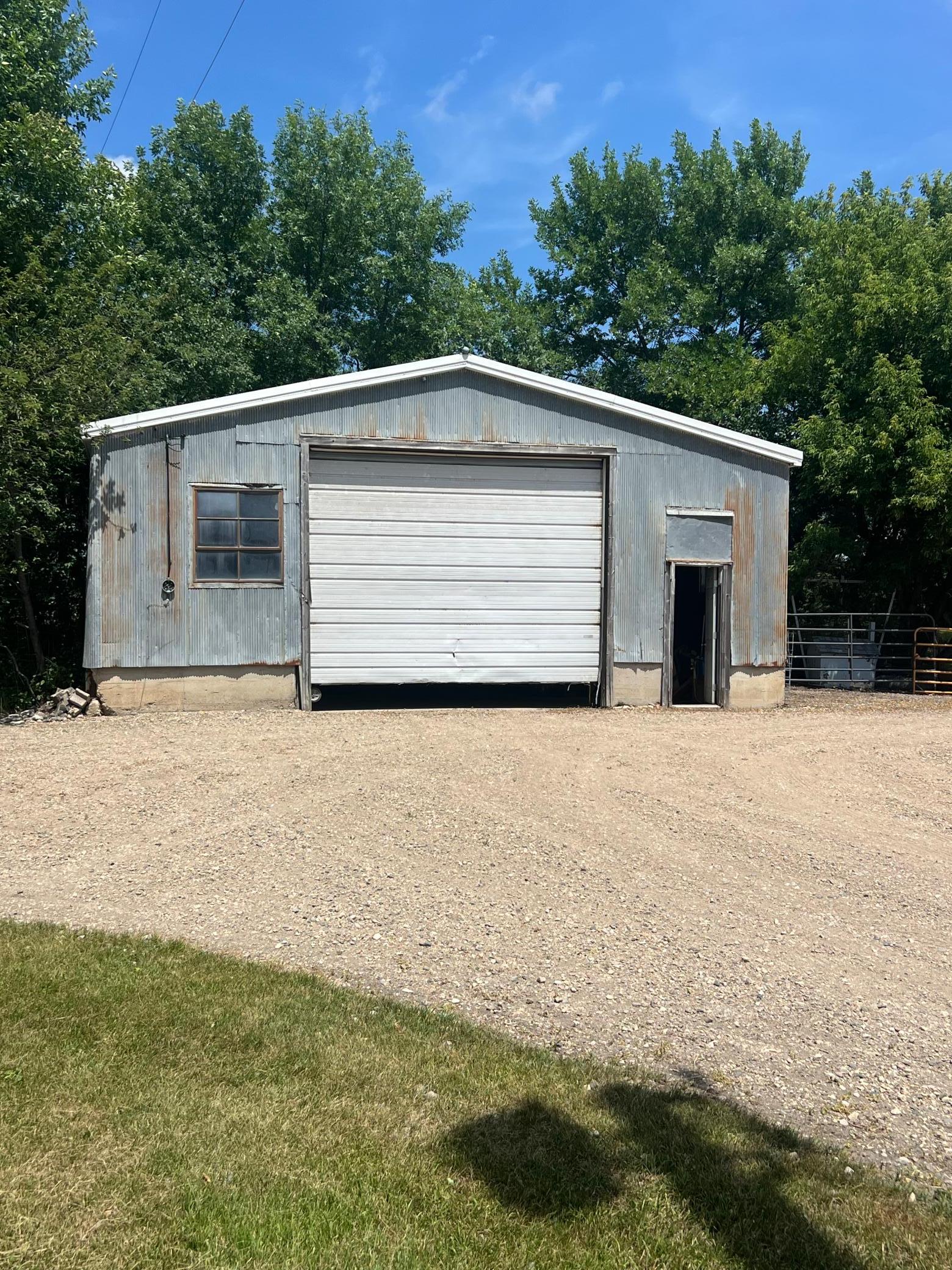Storage shed with concrete floor