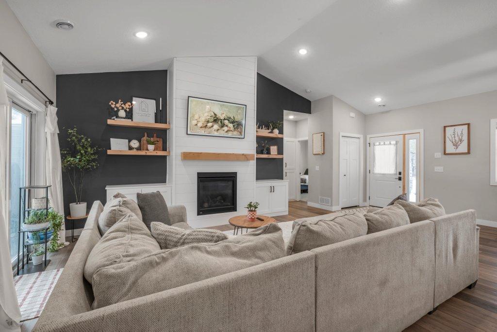 Vaulted Ceiling & Beautiful Fireplace Wall