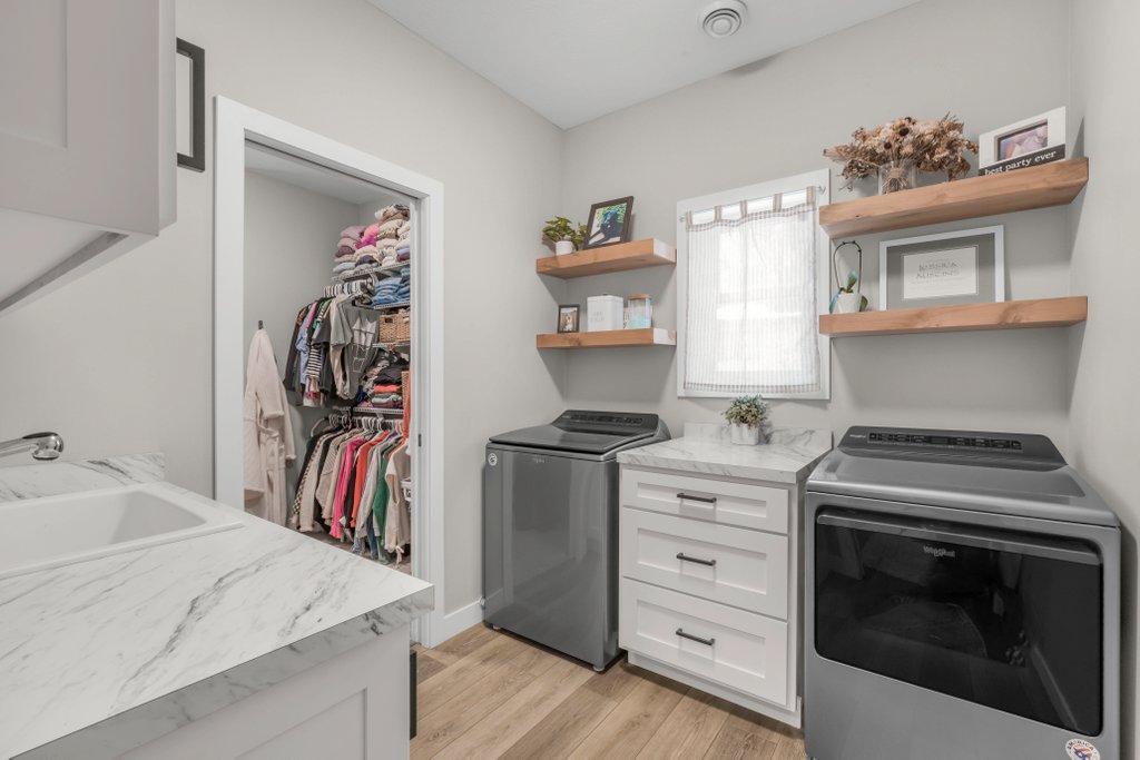 Laundry is next to the Primary Bedroom Walk in Closet