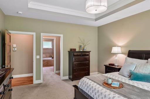The primary suite includes a private 4-piece bath, walk-in closet, and laundry for added convenience.