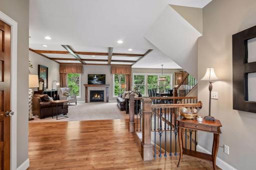 A view from the entry reveals beautiful white oak flooring extending throughout much of the main level.