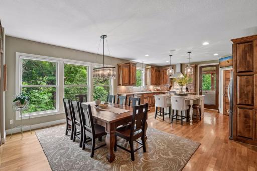 A seamless blend of kitchen and dining spaces, with white oak floors continuing throughout and 9-foot ceilings enhancing the open feel.