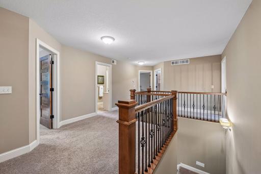 A welcoming upper-level landing with space for a chair or bench. Recently painted neutral walls and wide white woodwork throughout make it move-in ready. The home has zoned heat/air to keep every level comfortable.