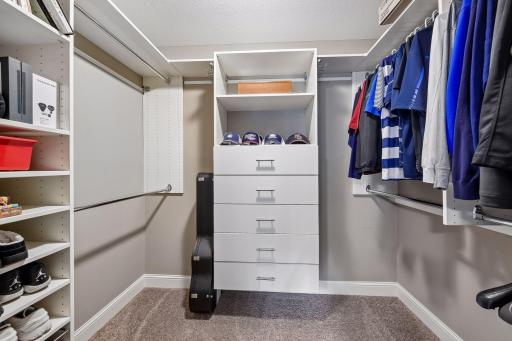The spacious 8x6 walk-in closet comes with a closet organizer system.