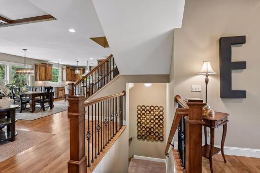 A wide stairway with landing leads to the walkout lower level.