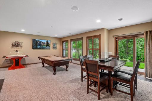 The walkout lower level is impressive, with a theatre area, wet bar, and a massive family room that accommodates multiple activity and seating areas.