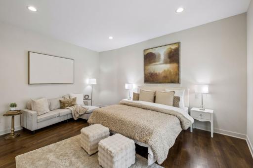Retreat to your luxurious main-level primary suite, a serene escape designed for rest and relaxation. Spacious and inviting, this private sanctuary offers the perfect place to unwind after a day on the lake and wake refreshed to another beautiful day