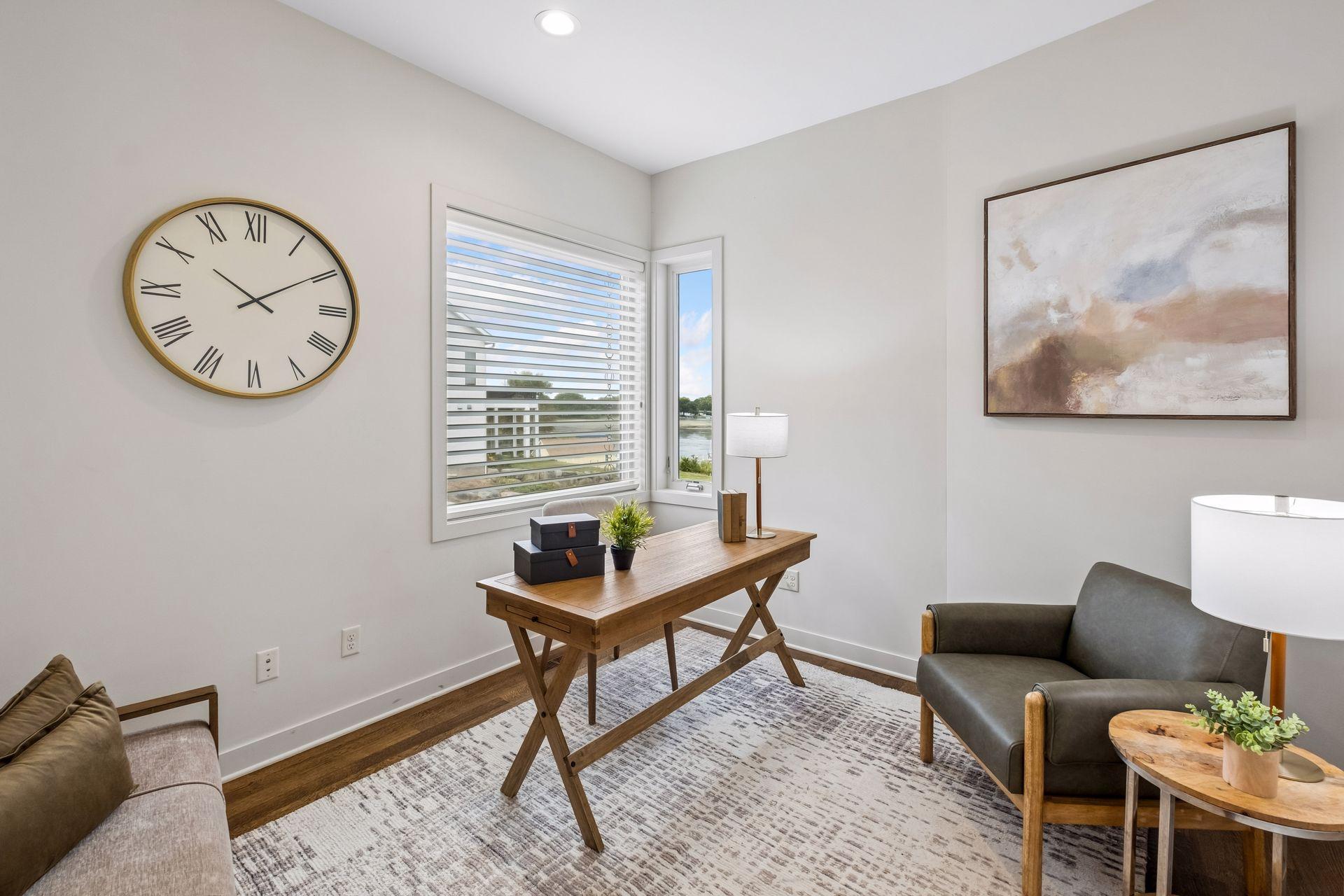 Balance work and waterfront living in this inviting main-level office. Natural light and lake views create an inspiring space to focus, dream and create, while keeping the beauty and tranquility of lake life just outside your window
