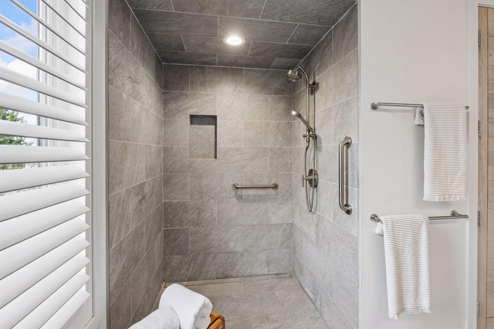 Thoughtfully designed zero-entry shower with seamless walk-in access and linear drain, blending luxury, safety and everyday ease for all ages and lifestyles.