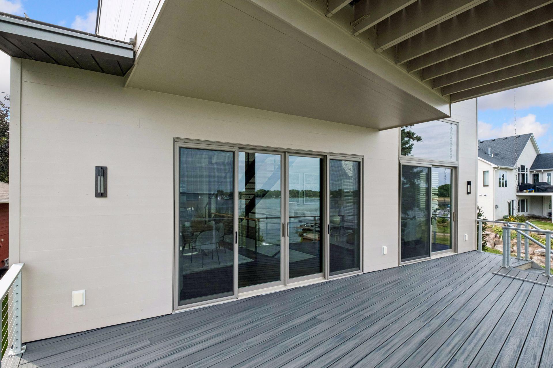 Designed for effortless indoor-outdoor living, this spacious deck offers panoramic Lake Waconia views and the perfect setting for alfresco dining, evening cocktails, and peaceful moments overlooking the water. Every day feels like a vacation.