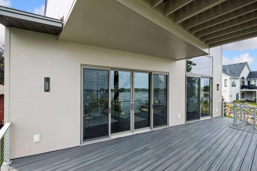 Designed for effortless indoor-outdoor living, this spacious deck offers panoramic Lake Waconia views and the perfect setting for alfresco dining, evening cocktails, and peaceful moments overlooking the water. Every day feels like a vacation.