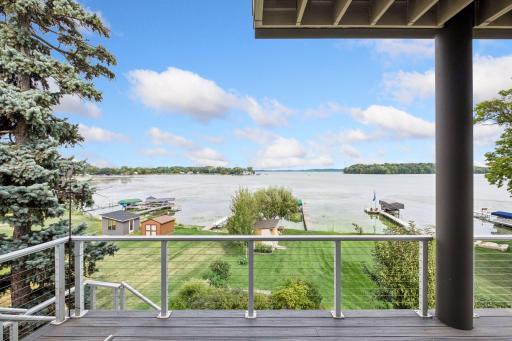 Step onto your main-level deck and embrace the magic of lake living. Take in panoramic water views, gentle breezes and unforgettable sunsets as boats glide by. The perfect setting for morning coffee, evening cocktails and making memories on the water