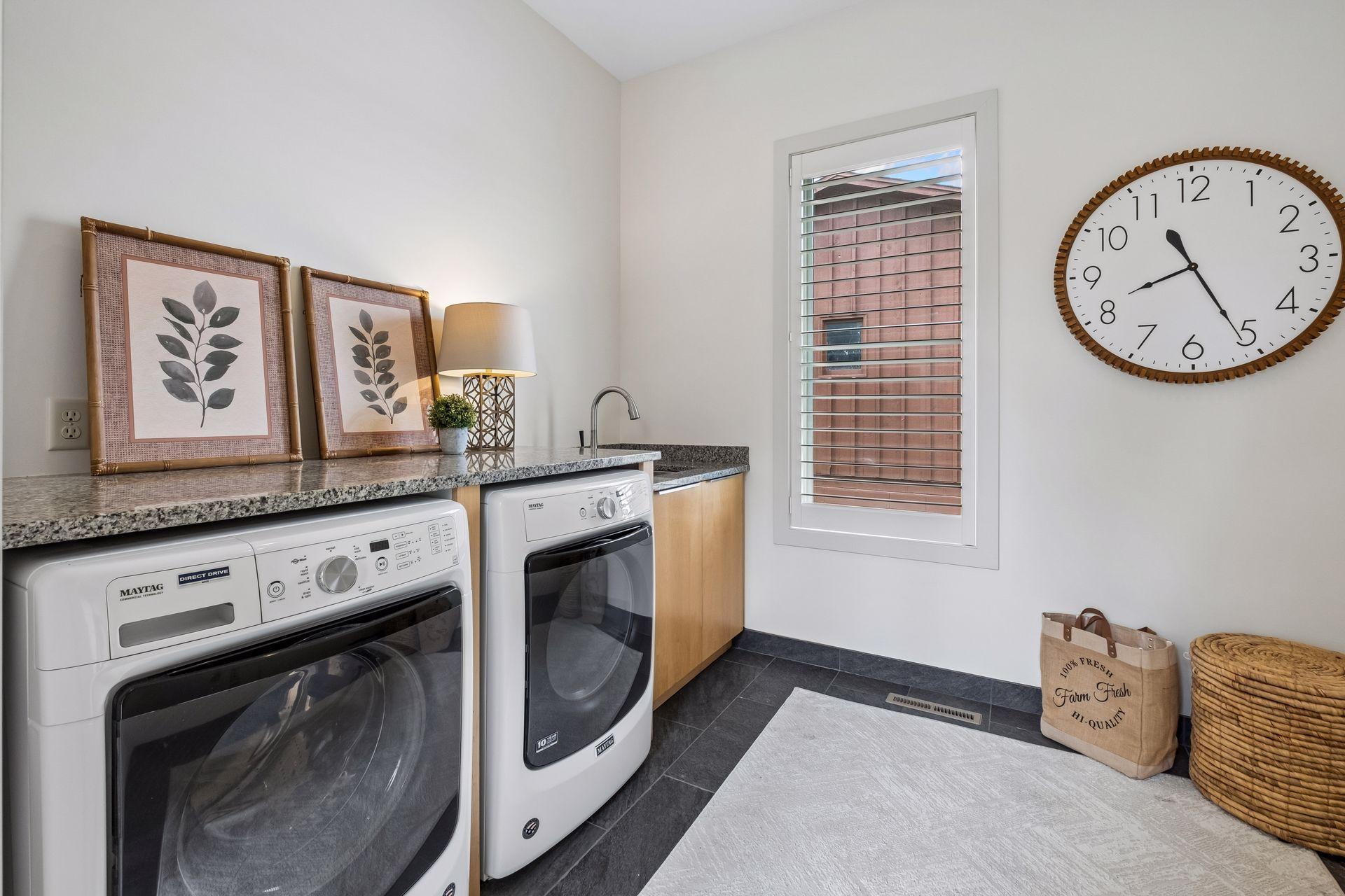 Designed for the realities of lake life, this spacious main-level laundry and mudroom offers the perfect transition from the water to home. Thoughtfully located off the garage entry, it keeps gear organized while making everyday living effortless