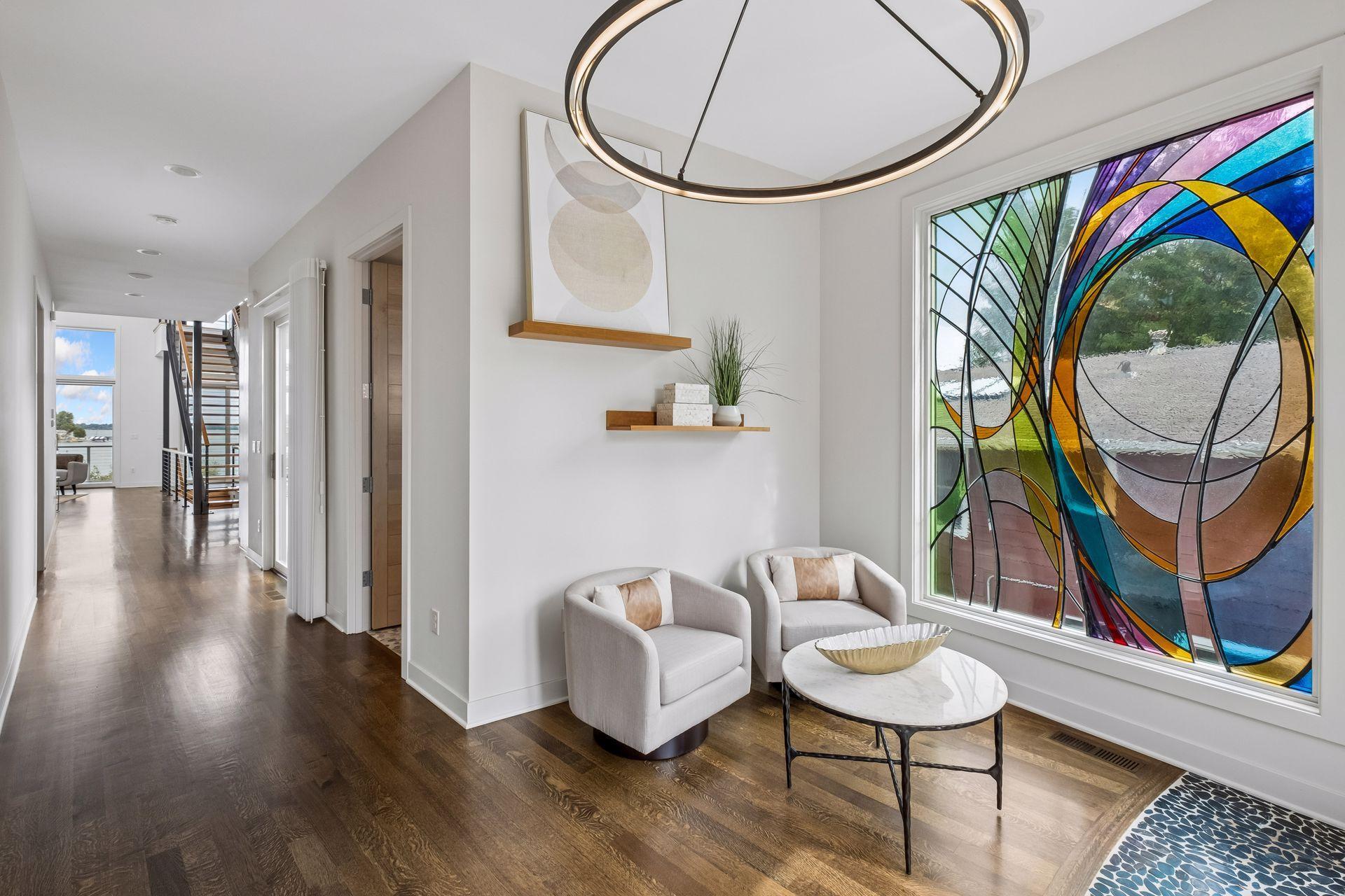 Incredible view as you enter your new lake home. Wide hallways allow access for any stage in life. Zero entry home. ML laundry, Zero entry shower in primary on main!