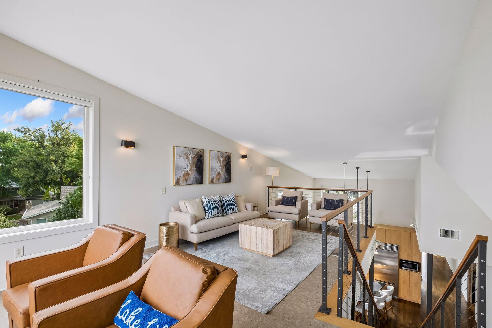 Perched above the water, this inviting loft offers a front-row seat to lake life at its finest. The perfect retreat for morning coffee, sunset conversations or a quiet escape, with breathtaking views. An open connection to the heart of the home below