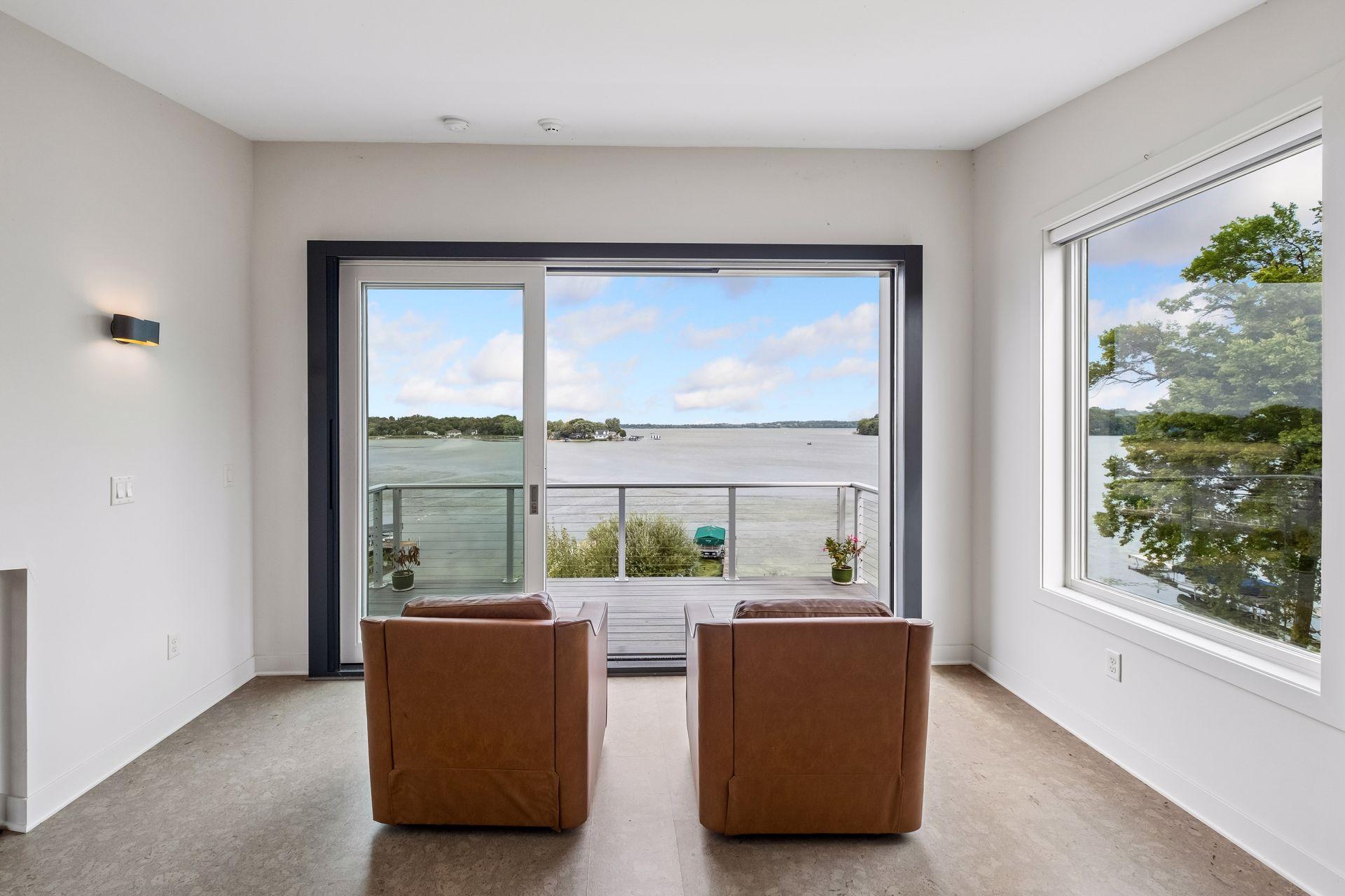 Lake life reaches new heights in this stunning upper-level retreat. Framed by panoramic water views and private balcony access, it's the perfect place to savor morning coffee, watch boats drift by, and unwind as the sun sets across the lake.