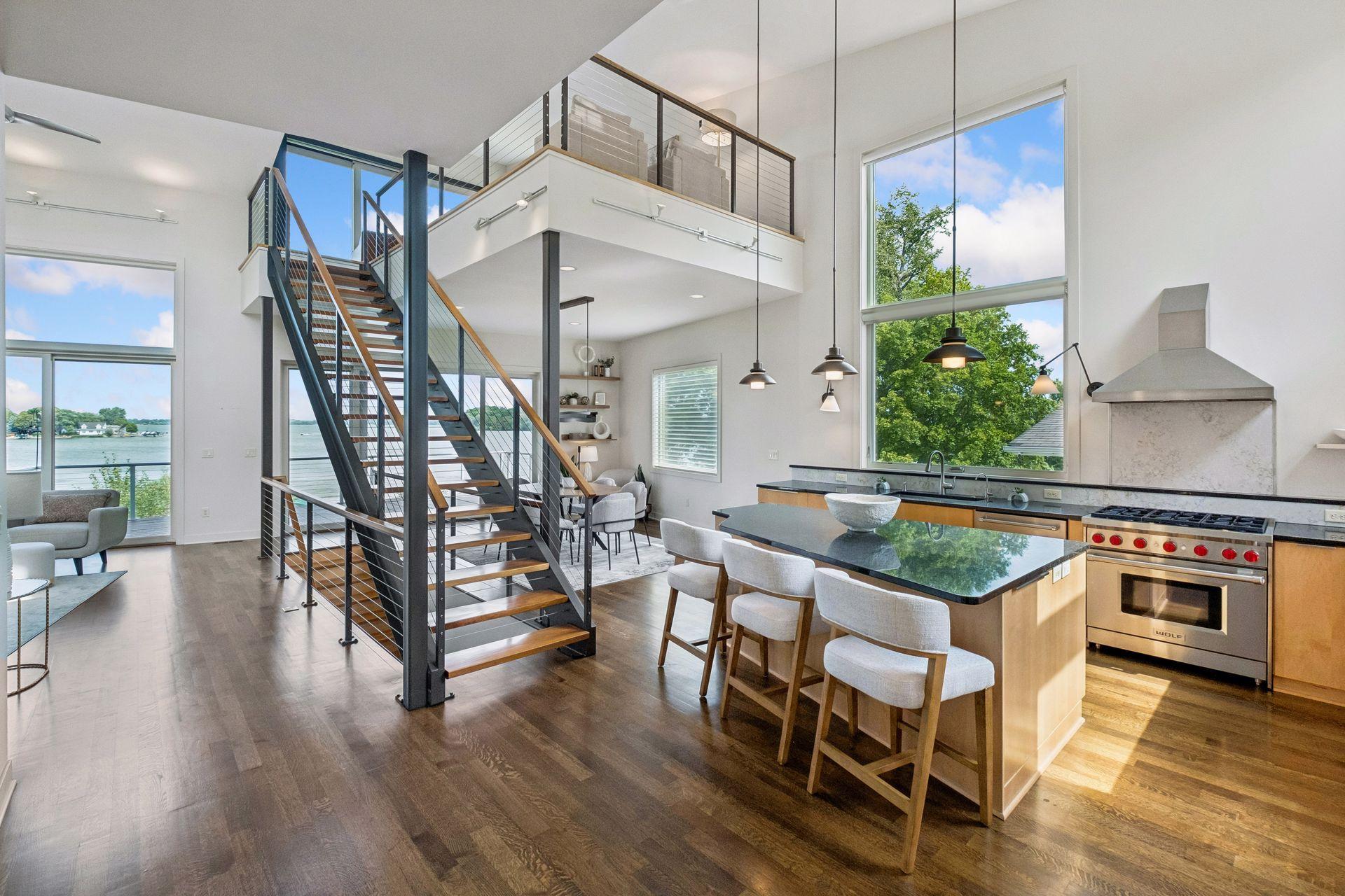 Where architecture and lake life become one, this stunning open-concept design showcases soaring ceilings, dramatic floating staircases, walls of glass and breathtaking water views. A masterpiece of modern living, crafted for unforgettable gatherings
