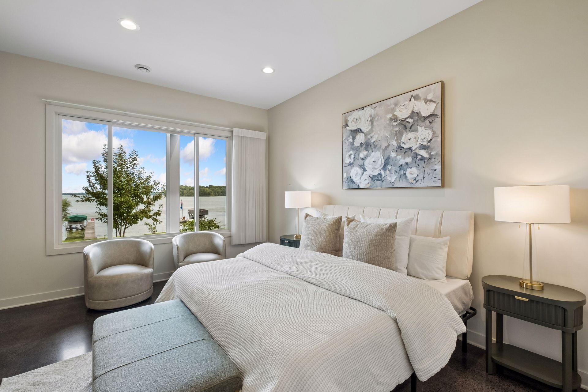 Wake up to sparkling lake views and end your day with sunsets reflected across the water. This inviting lakeside bedroom offers a peaceful retreat where every glance out the window reminds you why lake living is more than a home, it's a lifestyle.