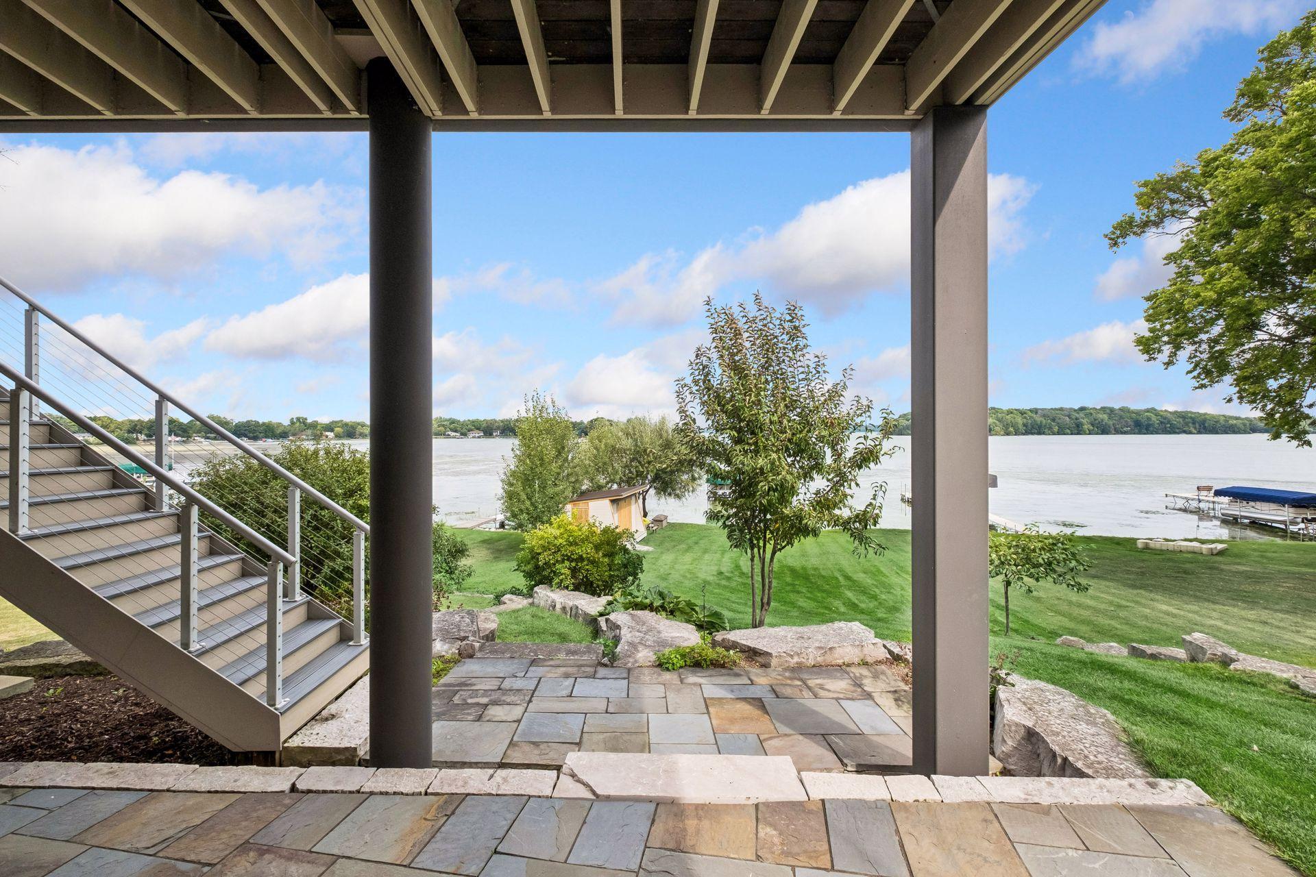 High demand Waconia lakefront with level lakeshore, incredible boat house shed plus stunning landscaping can be yours. Stroll to downtown Waconia one block away or Lola's lake house 4 blocks down Lake Street. Waconia has so much to offer year-round!