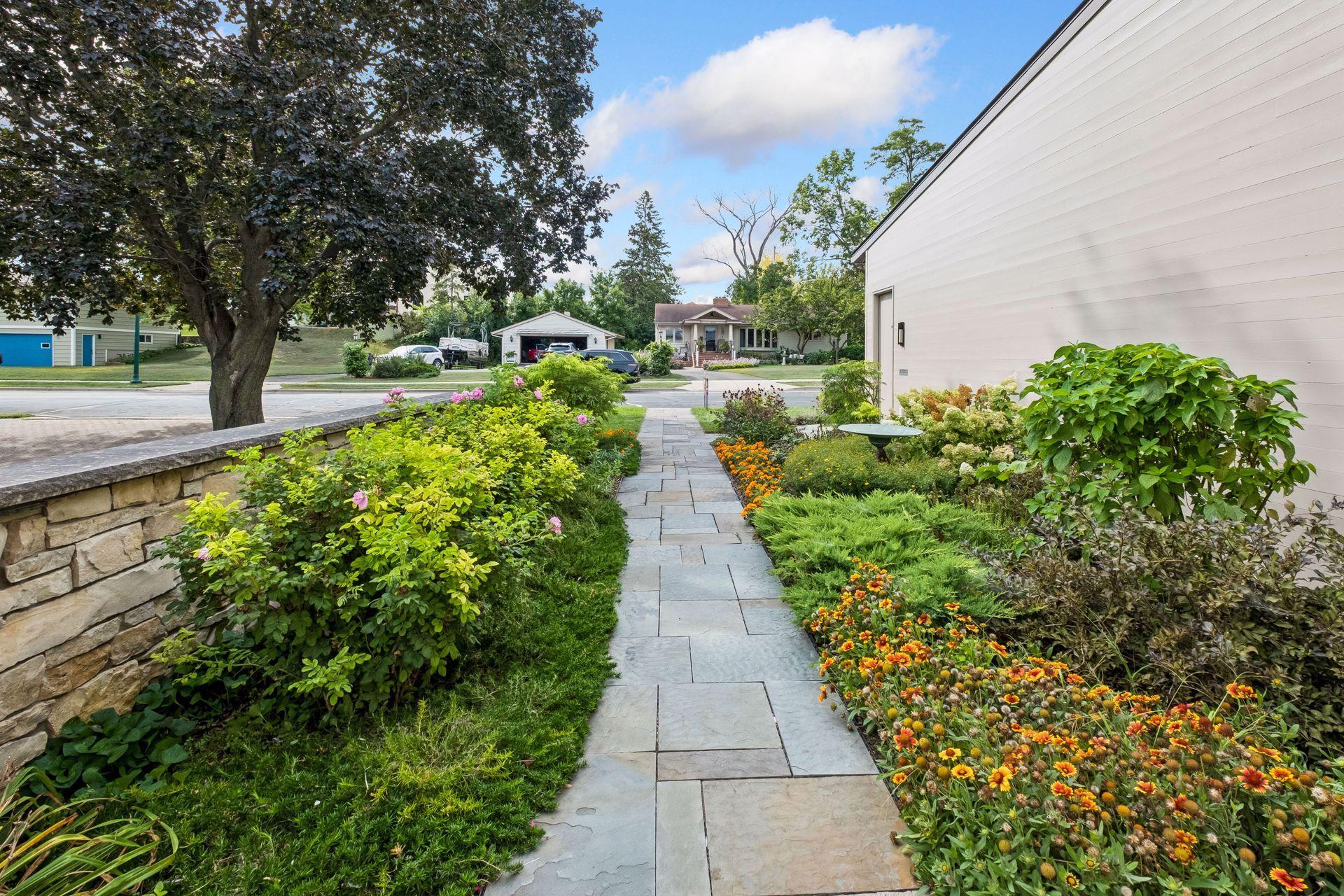 From the moment you step outside, beautifully landscaped grounds and a welcoming stone-lined walkway set the tone for the lake lifestyle ahead. Enjoy peaceful morning strolls, fresh lake breezes and the feeling of arriving at your own private retreat