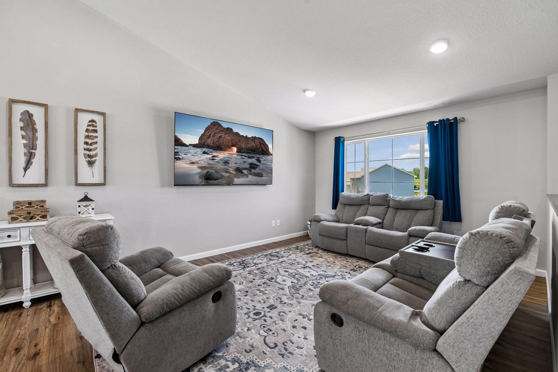 Bright and cheerful living room with tons of light from East and West.