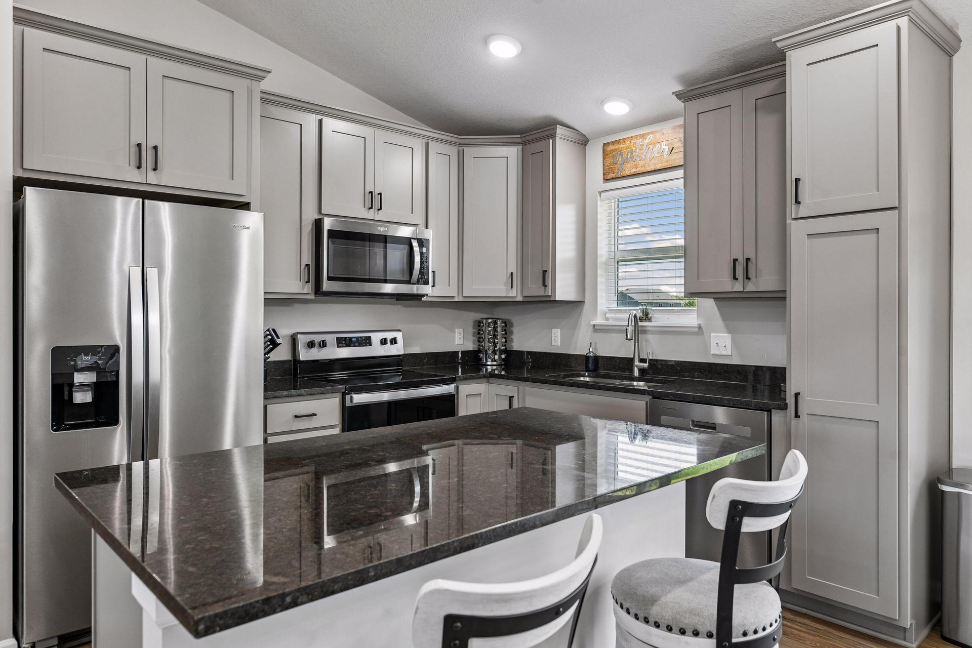 Ideal center island with seating for a quick bite to eat or extra seating if needed in kitchen area.