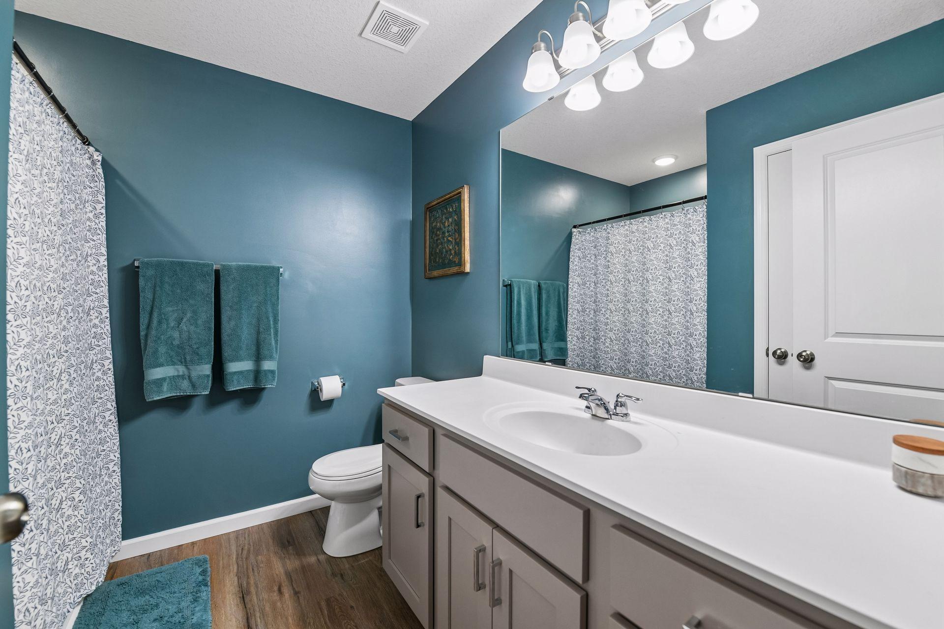 Three Fourth primary suite bath with extra linen closet in bathroom.