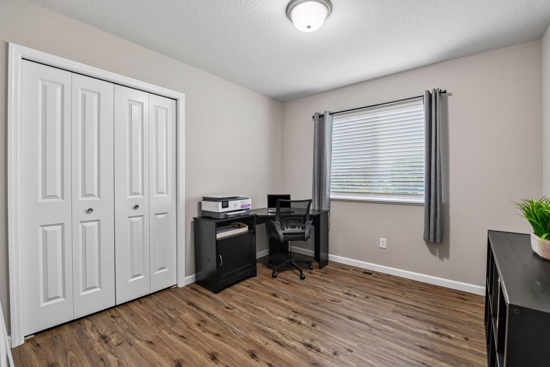Third bedroom on main with LVP flooring and nice closet storage space. New blinds throughout home as well.