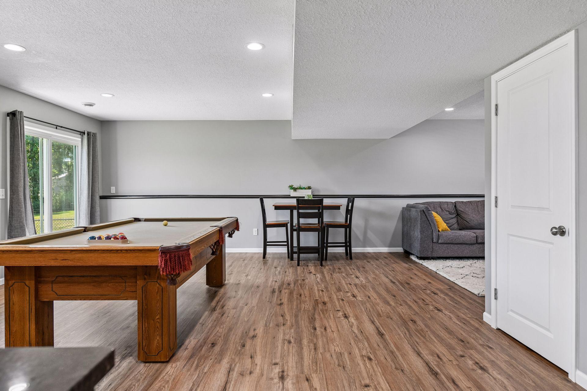 Knock down ceilings in lower-level w/tons canister lighting. ZONED heating / AC as well to control Main level and LL temperatures.